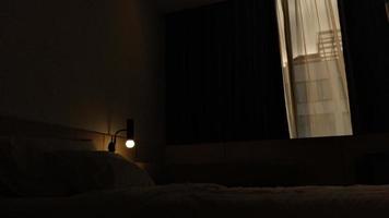 dark hotel room with yellow bulb light photo