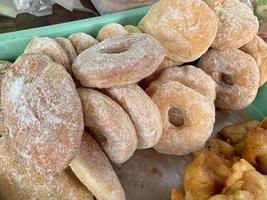 Indonesian traditional market snacks, powdered sugar donuts photo