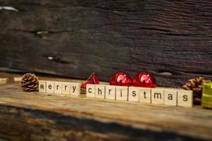 Merry Christmas.  wooden letters merry christmas word  on old wooden background photo