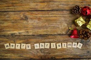 Merry Christmas.  wooden letters merry christmas word  on old wooden background photo