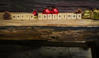 Merry Christmas.  wooden letters merry christmas word  on old wooden background photo