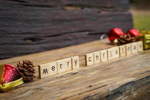 Merry Christmas.  wooden letters merry christmas word  on old wooden background photo