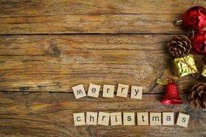 Merry Christmas.  wooden letters merry christmas word  on old wooden background photo