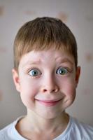 portrait of a boy with a surprised face photo