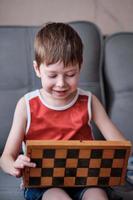 little boy playing chess photo