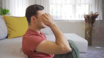 Feeling depressed at home, he put his hands on his head and got angry badly. Close-up of tired man with problems. video