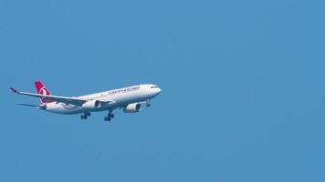 PHUKET, THAILAND NOVEMBER 27, 2019 - Wide body Airbus A330 of Turkish Airlines flies in the sky. The plane has released the landing gear at the airport video