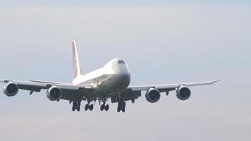 NOVOSIBIRSK, RUSSIA JUNE 10, 2020 - Boeing 747 wide body cargo plane approaches landing in the sun video