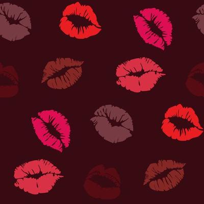 Seamless pattern with lipstick prints on a dark background in different red shades. Red lips as a background for gift wrapping. Suitable for printing on paper and textiles.