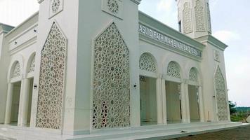 The white mosque building is very majestic. Taken from outside the building video