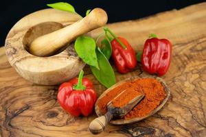 spicy pepper on olive wood photo