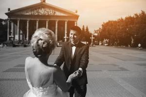 Young wedding couple walking photo