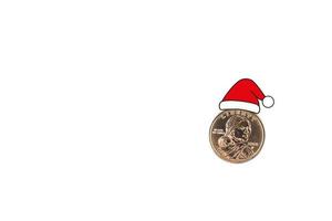One dollar gold coin in Santa Claus hat. white isolated background. photo