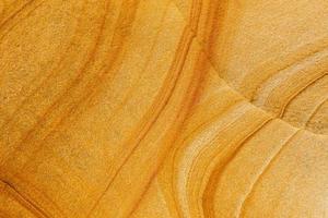 fondo de estructura de arenisca, textura de piedra natural, patrón abstracto en una roca foto