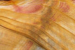 sandstone structure background, natural stone texture, abstract pattern on a rock photo