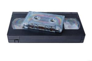 audio tape cassette and VHS video tape cassette on white background, isolated photo