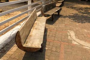 few wooden benches standing in the park photo