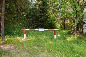 barrier in the forrest. The ban on entry into the forest. photo