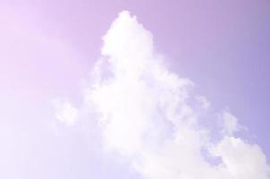 The masses of white smoke released into the air from the pipes of an industrial plant photo