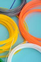 Plastic PLA and ABS filament material for printing on a 3D pen or printer of various colors photo