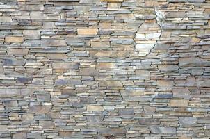 Modern pattern of flatten stone wall decorative surfaces in brown color photo