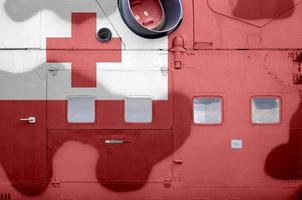 Tonga flag depicted on side part of military armored helicopter closeup. Army forces aircraft conceptual background photo