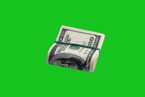 Bundle of US dollar bills isolated on chroma keyer green. Pack of american money with high resolution on perfect green mask photo