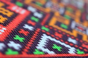 Traditional Ukrainian folk art knitted embroidery pattern on textile fabric photo