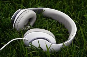 Headphones on green grass photo