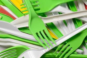 Pile of bright yellow, green and white used plastic kitchenware appliances photo