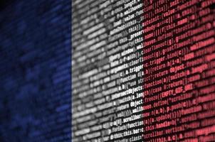 France flag  is depicted on the screen with the program code. The concept of modern technology and site development photo