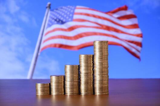 Golden coin stacks arranged as a graph. Increasing columns of coins photo
