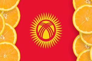 Kyrgyzstan flag  in citrus fruit slices vertical frame photo