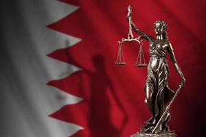 Bahrain flag with statue of lady justice and judicial scales in dark room. Concept of judgement and punishment photo