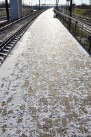 Empty railway station platform photo