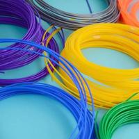 Plastic PLA and ABS filament material for printing on a 3D pen or printer of various colors photo