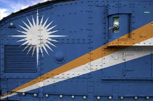 Marshall Islands flag depicted on side part of military armored tank closeup. Army forces conceptual background photo