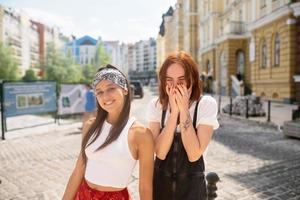 Two funny friends outdoors in the street photo