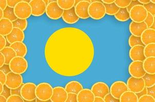 Palau flag  in fresh citrus fruit slices frame photo