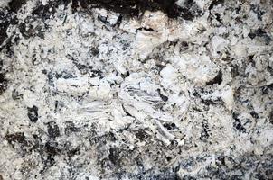 Pile of ashes after the fire went out grunge background texture photo