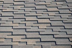 Modern roofing and decoration of chimneys. Flexible bitumen or slate shingles photo