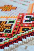 Traditional Ukrainian folk art knitted embroidery pattern on textile fabric photo