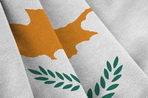Cyprus flag with big folds waving close up under the studio light indoors. The official symbols and colors in banner photo