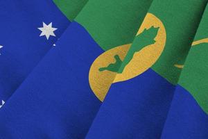 Christmas island flag with big folds waving close up under the studio light indoors. The official symbols and colors in banner photo