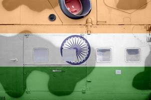 India flag depicted on side part of military armored helicopter closeup. Army forces aircraft conceptual background photo