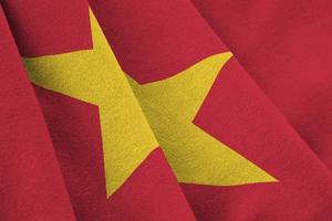 Vietnam flag with big folds waving close up under the studio light indoors. The official symbols and colors in banner photo