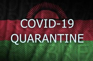 Malawi flag and Covid-19 quarantine inscription. Coronavirus or 2019-nCov virus photo