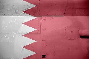 Bahrain flag depicted on side part of military armored helicopter closeup. Army forces aircraft conceptual background photo