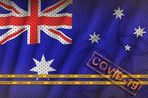 Australia flag and orange Covid-19 stamp with border tape. Coronavirus or 2019-nCov virus concept photo