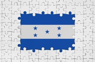 Honduras flag in frame of white puzzle pieces with missing central part photo